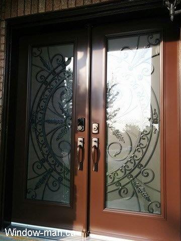 Double entry door. Steel insulated.  Chocolate brown. Full wrought iron glass inserts. San Pedro design